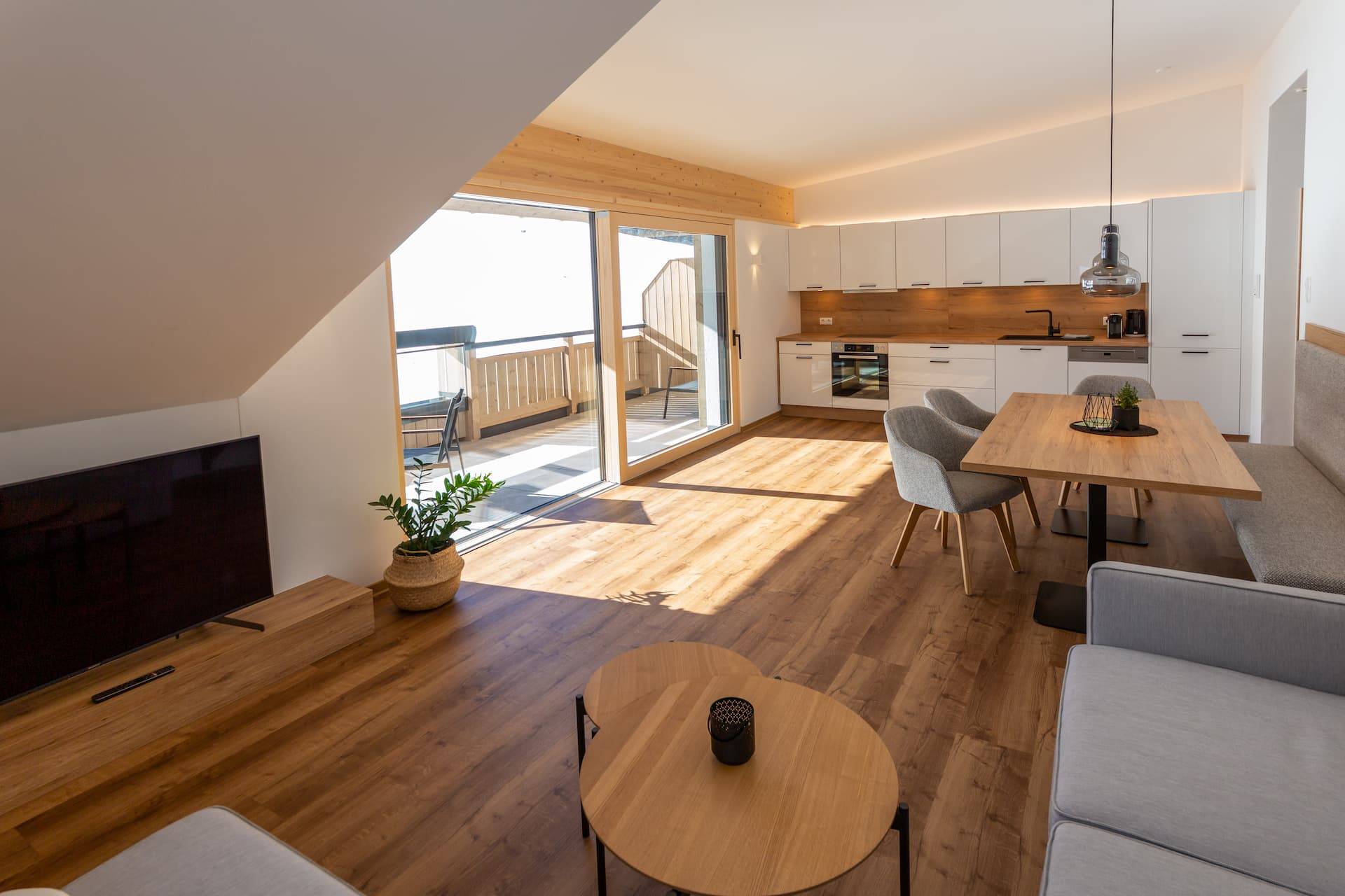 The living room including kitchen of the Bergbalance apartment in Altenmarkt-Zauchensee